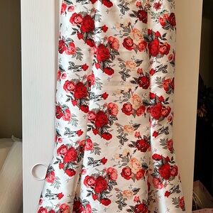 Red and Pink Ruffled mermaid dress with small train Beaded at the waist.